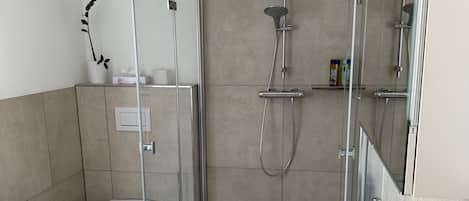 Shower, hair dryer, towels, soap