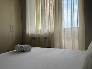 Deluxe Apartment, 2 Bedrooms, Balcony, Courtyard View | Blackout curtains, soundproofing, iron/ironing board, free WiFi