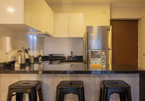 Fridge, microwave, stovetop, coffee/tea maker