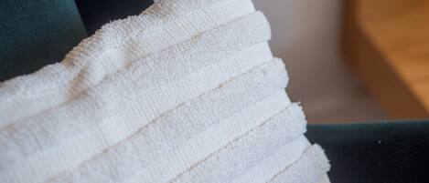 A white towel with horizontal stripes.