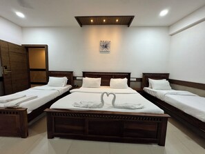 Deluxe Quadruple Room | Premium bedding, free WiFi, bed sheets - Col's Hotel Uphaar (Ujjain)