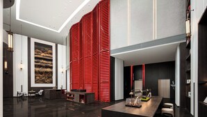 A modern lobby with a reception desk, seating area, and a large abstract painting on the wall. - GWEN JANE Hotel - Guangzhou Yuexiu Taojin Metro Station Branch (Guangzhou)