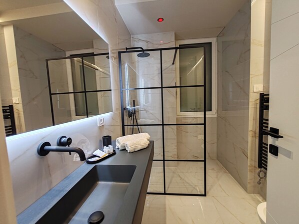 Shower, eco-friendly toiletries, hair dryer, bidet