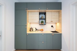 Fridge, coffee/tea maker, electric kettle, cookware/dishes/utensils