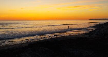 Maison confortable Ă 100m de la plage avec grand balcon et jardin