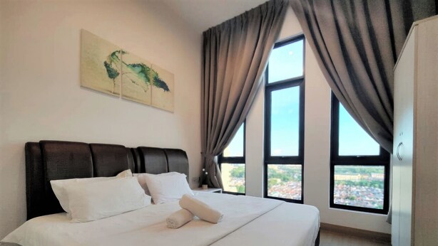 A neatly made bed with white linens, a headboard, and a painting on the wall. - The Grand Subang Jaya SS15 By Emily in Town (Subang Jaya)