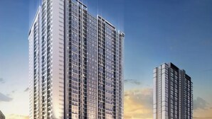 A high-rise residential building with multiple balconies, a ground-level commercial area, and a neighboring shorter building. - Luxstay Atria Sofo Suites Apartments (Petaling Jaya)