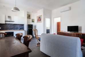 Classic Apartment, Garden View | Living area | 30-inch TV with satellite channels - Penthouses with Terrace by Wonderful Italy (Bari)