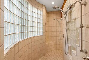Shower, hair dryer, towels, shampoo