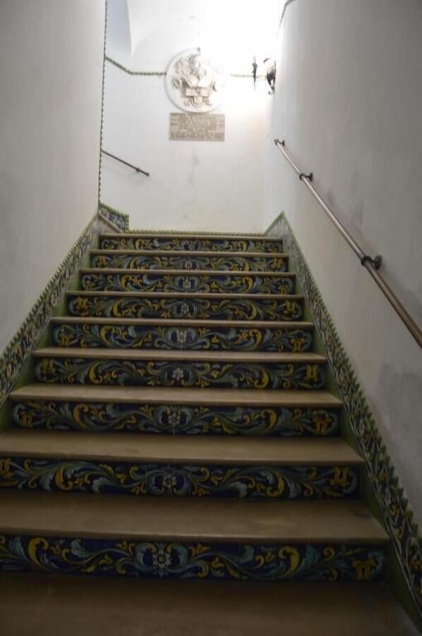 A staircase with ornate blue and yellow patterns.