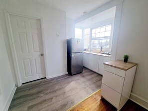 Fridge, microwave, stovetop, coffee/tea maker
