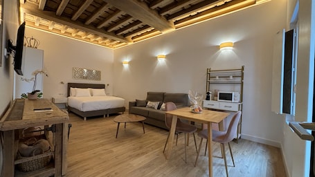 Junior Suite, City View | Desk, laptop workspace, soundproofing, iron/ironing board