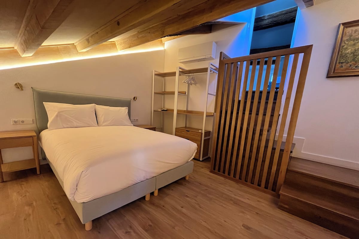 Superior Suite, City View | Desk, laptop workspace, soundproofing, iron/ironing board