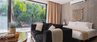 Experience true luxury in this stunning two-bedroom condo in Tulum