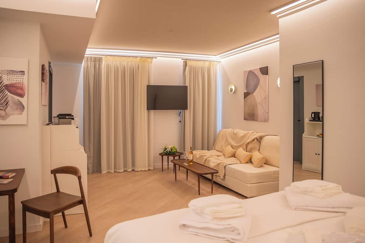 Luxury Suite, Balcony, Garden View | Hypo-allergenic bedding, in-room safe, iron/ironing board, free WiFi