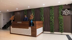 A reception desk with a sign reading "RECEPTION" and "HP HOTEL PARAS". - HOTEL PARAS CHITTORGARH (Chittorgarh)