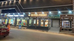 A hotel named 'Hotel Paras' with a sign in a local language, adjacent to 'Paris Furniture'. - HOTEL PARAS CHITTORGARH (Chittorgarh)