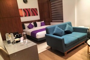 Minibar, desk, blackout curtains, iron/ironing board