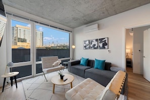Superior Apartment, City View | Living area | 75-inch Smart TV with digital channels, Netflix, streaming services