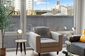 City Apartment, City View | Living area | 75-inch Smart TV with digital channels, Netflix, streaming services - ENVITAE Hotel 4 Bedroom Luxury Apartments (Chicago)