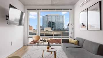 Standard Apartment, City View | Living area | 75-inch Smart TV with digital channels, Netflix, streaming services