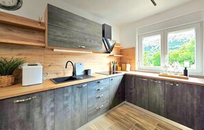 Fridge, stovetop, coffee/tea maker, cookware/dishes/utensils