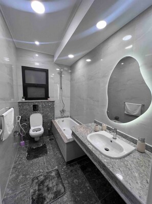 Shower, towels, soap, toilet paper
