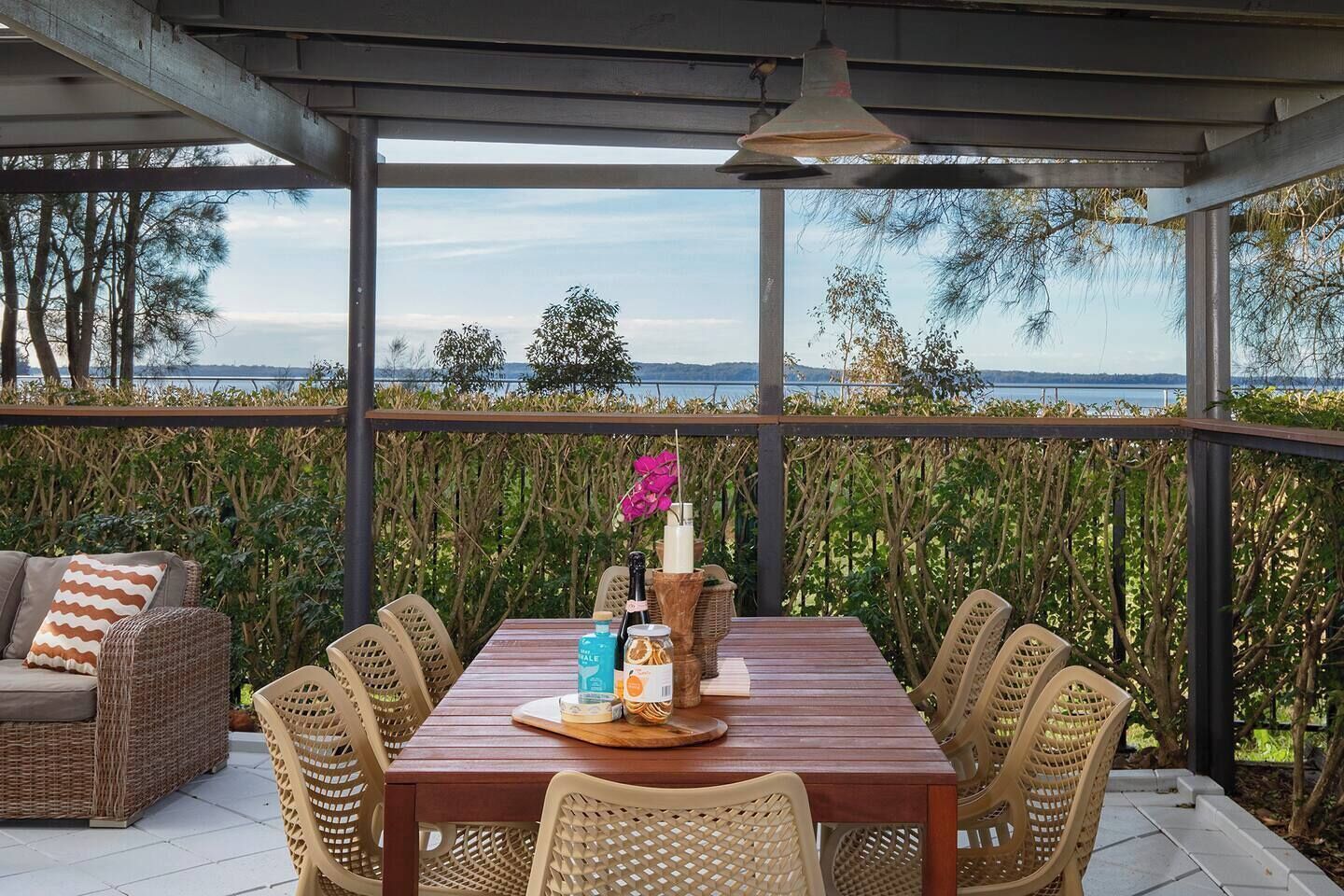 Dine under cover with a backdrop of greenery and glimpses of Tuggerah Lake.