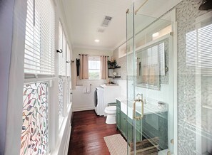 Shower, hair dryer, towels, shampoo