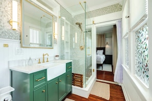 Shower, hair dryer, towels, shampoo