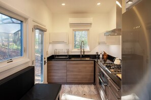 Fridge, oven, coffee/tea maker, cookware/dishes/utensils