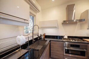 Fridge, oven, coffee/tea maker, cookware/dishes/utensils