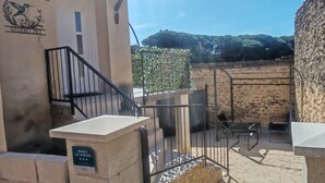 A building with a sign reading "STUDIO 263" and a plaque labeled "MEUBLE DE TOURISME". - STUDIO 263 "Studio with Provencal charm in Suze-la-Rousse - Calm & authenticity (Suze-la-Rousse)