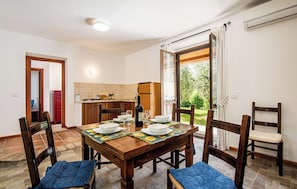 Villa | Living area | 32-inch TV with cable channels, fireplace