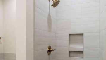 Shower, hair dryer, towels, shampoo