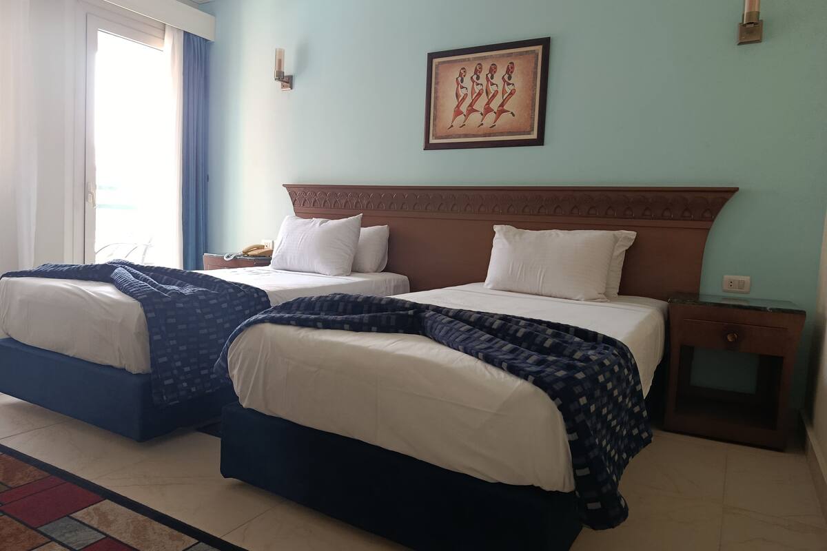 Double Room, Pool View | In-room safe, blackout drapes, free WiFi