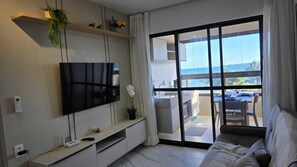 Apartamento luxo, vista para a praia | Área de estar