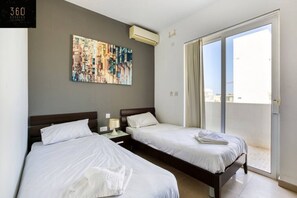 1 bedroom, desk, iron/ironing board, travel crib