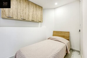 1 bedroom, desk, iron/ironing board, travel cot