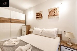 1 bedroom, desk, iron/ironing board, travel cot