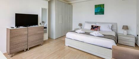 1 bedroom, desk, iron/ironing board, travel crib