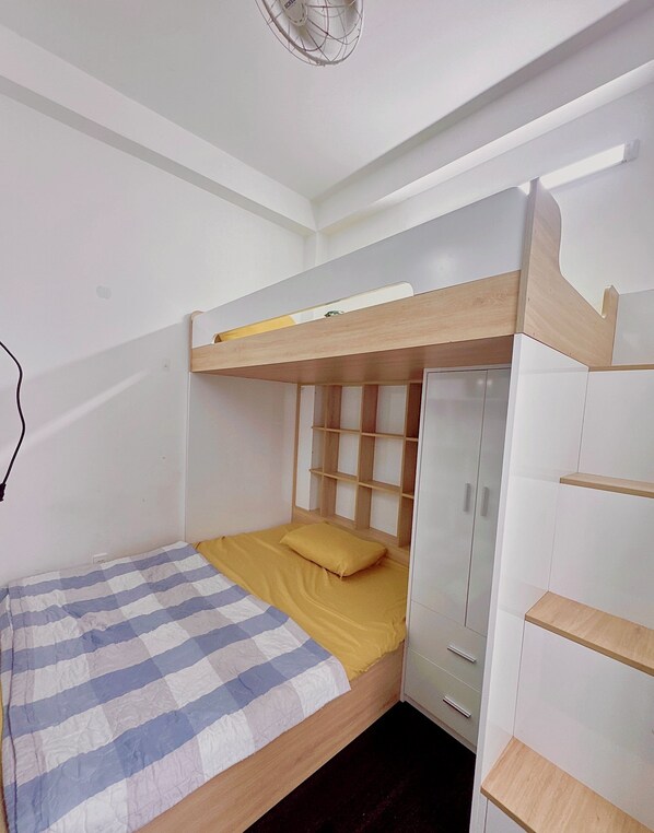 A bunk bed with a wooden headboard and a bedside table. - The Hidden Hogwarts - Nearly Bui Vien (Ho Chi Minh City)