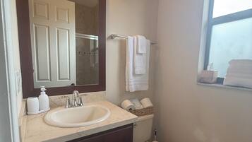 Shower, hair dryer, towels, soap