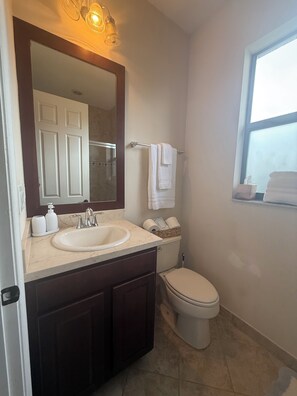 Shower, hair dryer, towels, soap