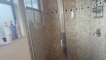 Shower, hair dryer, towels, soap