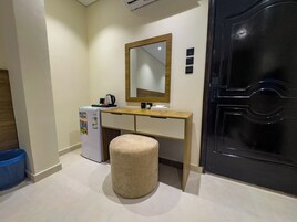 Desk, laptop workspace, blackout drapes, iron/ironing board