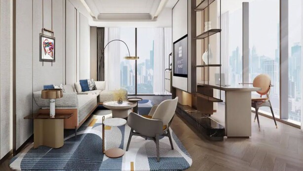 A modern living room with a sofa, coffee table, and chairs, a bookshelf, and a city view. - Hyatt Place Kunshan Gaoxin (Suzhou)