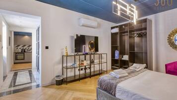1 bedroom, desk, iron/ironing board, travel crib