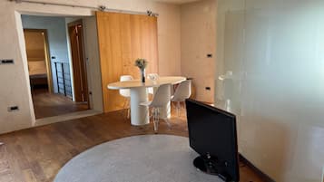 Superior Apartment | Living area | 40-inch Smart TV with digital channels