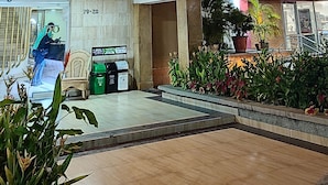 The exterior of Hotel Dorado with a prominent entrance, a well-lit facade, and a visible reception area. - Hotel Dorado Baq (Barranquilla)
